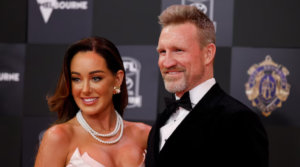 Nathan Buckley and partner Brodie Ryan arrive at the 2024 Brownlow Medal red carpet.  (Getty: Dylan Burns)